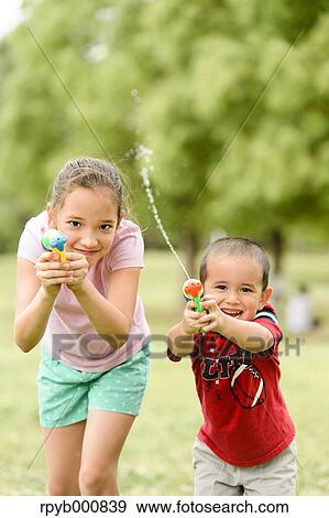 Young Japanese kids playing in a park View Large Photo Image Stock Photo - Young Japanese kids playing in a park. Fotosearch