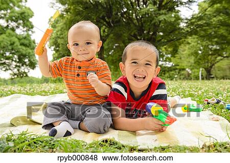 Young Japanese kids playing in a park View Large Photo Image Stock Photo - Young Japanese kids playing in a park. Fotosearch