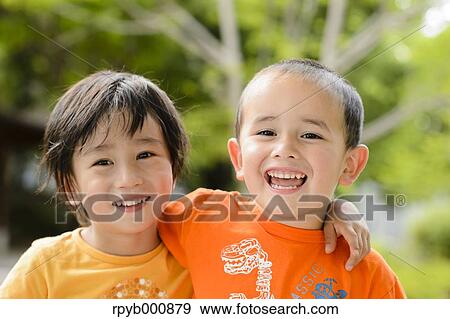 Young Japanese kids playing in a park View Large Photo Image Stock Photo - Young Japanese kids playing in a park. Fotosearch