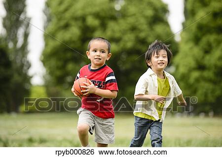 Young Japanese kids playing in a park View Large Photo Image Stock Photograph - Young Japanese kids playing in a park. Fotosearch