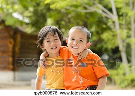 Young Japanese kids playing in a park View Large Photo Image Stock Photograph - Young Japanese kids playing in a park. Fotosearch