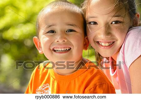 Stock Photograph - Young Japanese kids playing in a park. Fotosearch