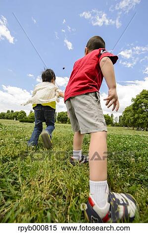 Young Japanese kids playing in a park View Large Photo Image Stock Photography - Young Japanese kids playing in a park. Fotosearch