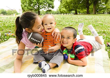 Young Japanese kids playing in a park View Large Photo Image Stock Photography - Young Japanese kids playing in a park. Fotosearch