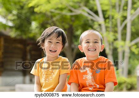 Young Japanese kids playing in a park View Large Photo Image Stock Photography - Young Japanese kids playing in a park. Fotosearch