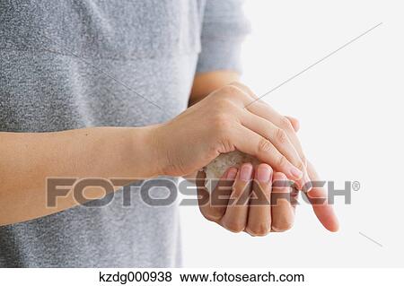 Stock Photo - Young Japanese woman preparing Onigiri rice balls. Fotosearch