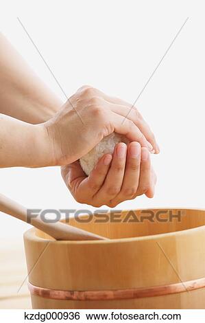 Young Japanese woman preparing Onigiri rice balls View Large Photo Image Stock Photograph - Young Japanese woman preparing Onigiri rice balls. Fotosearch