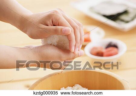 Young Japanese woman preparing Onigiri rice balls View Large Photo Image Stock Photography - Young Japanese woman preparing Onigiri rice balls. Fotosearch