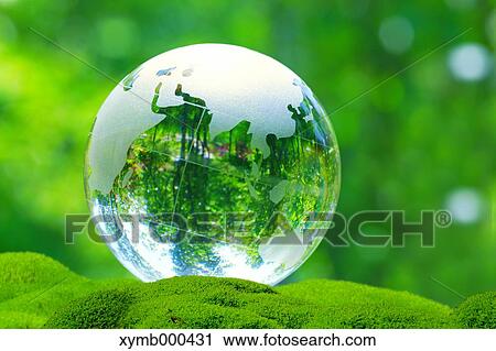 Stock Image - Glass globe in a park. Fotosearch