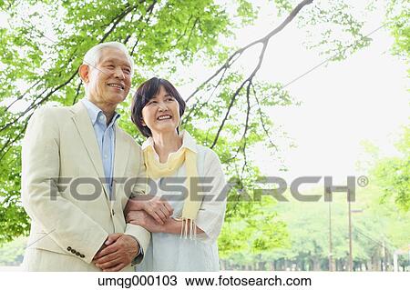 Senior adult Japanese couple in a park View Large Photo Image Stock Image - Senior adult Japanese couple in a park. Fotosearch