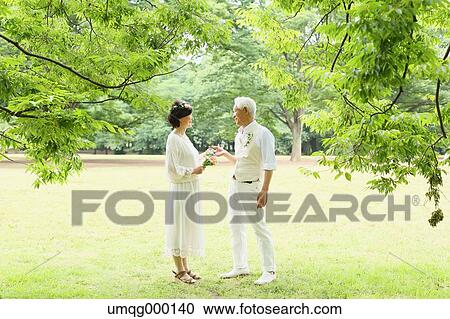 Senior adult Japanese couple in a park View Large Photo Image Stock Image - Senior adult Japanese couple in a park. Fotosearch
