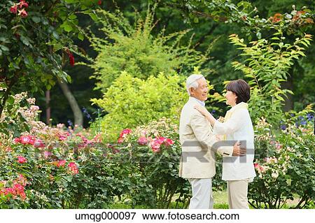 Stock Photo - Senior adult Japanese couple in a park. Fotosearch