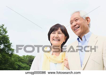 Senior adult Japanese couple in a park View Large Photo Image Stock Photograph - Senior adult Japanese couple in a park. Fotosearch