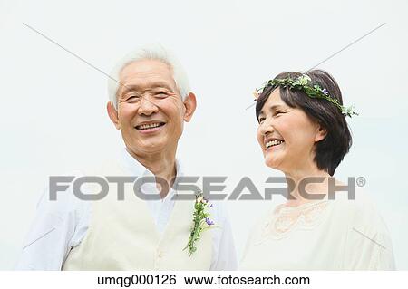 Stock Photograph - Senior adult Japanese couple in a park. Fotosearch