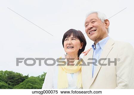 Stock Photography - Senior adult Japanese couple in a park. Fotosearch