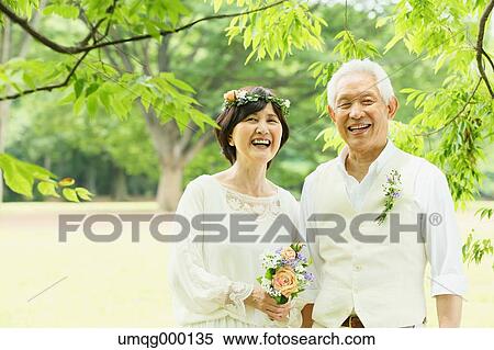 Stock Photography - Senior adult Japanese couple in a park. Fotosearch