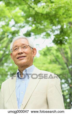 Senior adult Japanese man in a park View Large Photo Image Stock Photo - Senior adult Japanese man in a park. Fotosearch