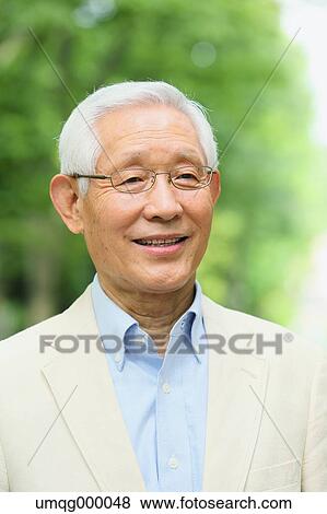 Senior adult Japanese man in a park View Large Photo Image Stock Photo - Senior adult Japanese man in a park. Fotosearch