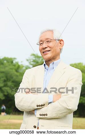Stock Photo - Senior adult Japanese man in a park. Fotosearch