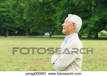 Stock Photo - Senior adult Japanese man in a park. Fotosearch