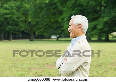 Senior adult Japanese man in a park View Large Photo Image Stock Photograph - Senior adult Japanese man in a park. Fotosearch