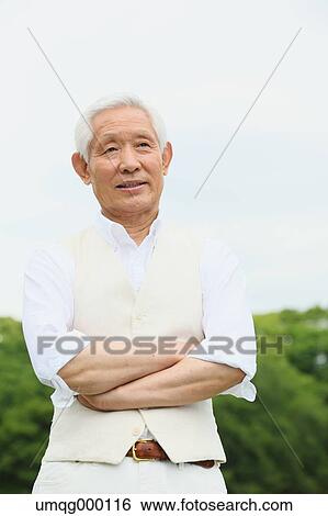 Stock Photograph - Senior adult Japanese man in a park. Fotosearch
