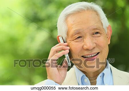 Senior adult Japanese man with smartphone in a park View Large Photo Image Stock Photography - Senior adult Japanese man with smartphone in a park. Fotosearch