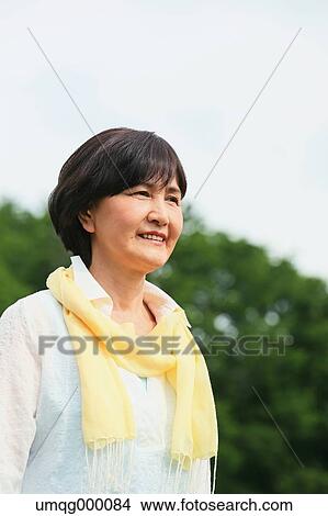 Senior adult Japanese woman in a park View Large Photo Image Picture - Senior adult Japanese woman in a park. Fotosearch