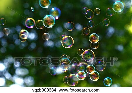 Soap bubbles in a park View Large Photo Image Picture - Soap bubbles in a park. Fotosearch