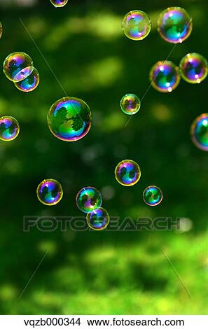 Soap bubbles in a park View Large Photo Image Picture - Soap bubbles in a park. Fotosearch
