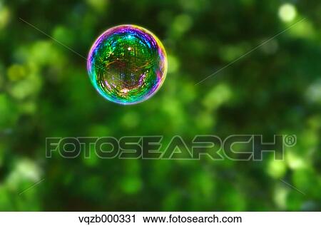 Soap bubbles in a park View Large Photo Image Stock Image - Soap bubbles in a park. Fotosearch