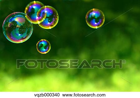 Soap bubbles in a park View Large Photo Image Stock Image - Soap bubbles in a park. Fotosearch