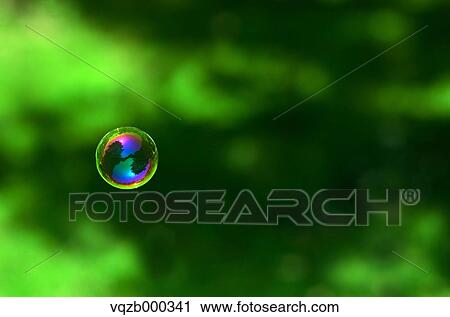 Stock Image - Soap bubbles in a park. Fotosearch