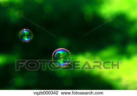 Soap bubbles in a park View Large Photo Image Stock Image - Soap bubbles in a park. Fotosearch