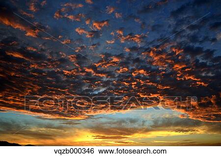 Sunset clouds View Large Photo Image Stock Photograph - Sunset clouds. Fotosearch