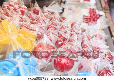 Stock Photo - Apple candies at Japanese traditional festival. Fotosearch