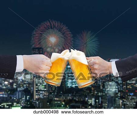 Businessmen toasting with draft beer View Large Photo Image Stock Photo - Businessmen toasting with draft beer. Fotosearch