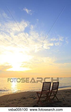 Chairs At The Beach At Sunset View Large Photo Image Stock Image - Chairs At The Beach At Sunset. Fotosearch