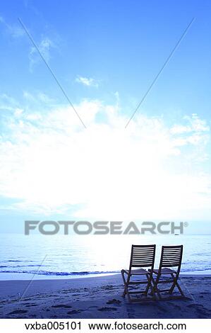 Chairs At The Beach At Sunset View Large Photo Image Stock Image - Chairs At The Beach At Sunset. Fotosearch