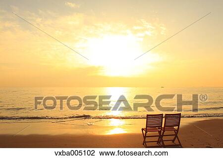 Chairs At The Beach At Sunset View Large Photo Image Stock Image - Chairs At The Beach At Sunset. Fotosearch