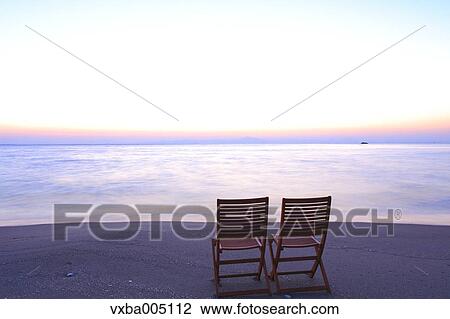 Chairs At The Beach At Sunset View Large Photo Image Stock Image - Chairs At The Beach At Sunset. Fotosearch