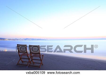 Chairs At The Beach At Sunset View Large Photo Image Stock Photo - Chairs At The Beach At Sunset. Fotosearch