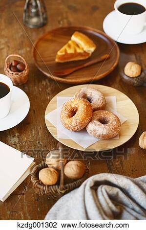 Stock Image - Coffee And Pastry On Wooden Table. Fotosearch