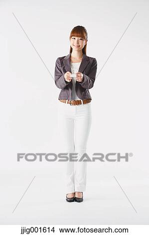 Full length portrait of Japanese young businesswoman against white background View Large Photo Image Picture - Full length portrait of Japanese young businesswoman against white background. Fotosearch