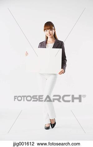 Full length portrait of Japanese young businesswoman against white background View Large Photo Image Stock Image - Full length portrait of Japanese young businesswoman against white background. Fotosearch