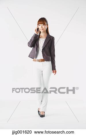 Full length portrait of Japanese young businesswoman against white background View Large Photo Image Stock Image - Full length portrait of Japanese young businesswoman against white background. Fotosearch