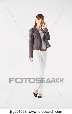 Full length portrait of Japanese young businesswoman against white background View Large Photo Image Stock Image - Full length portrait of Japanese young businesswoman against white background. Fotosearch