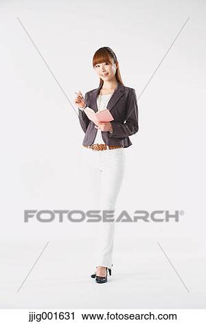 Full length portrait of Japanese young businesswoman against white background View Large Photo Image Stock Image - Full length portrait of Japanese young businesswoman against white background. Fotosearch