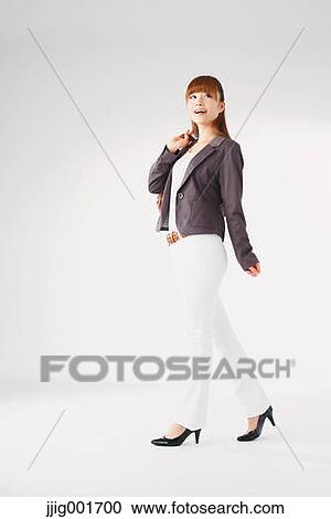 Full length portrait of Japanese young businesswoman against white background View Large Photo Image Stock Image - Full length portrait of Japanese young businesswoman against white background. Fotosearch