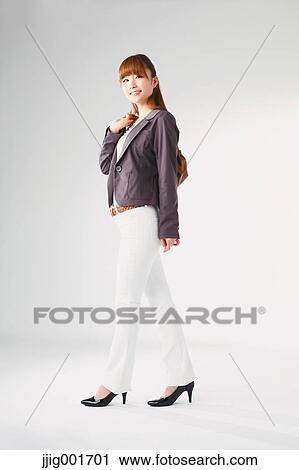 Full length portrait of Japanese young businesswoman against white background View Large Photo Image Stock Image - Full length portrait of Japanese young businesswoman against white background. Fotosearch